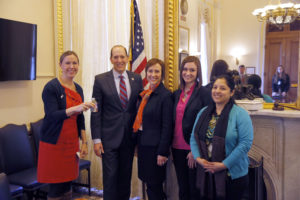 Lisa Bos (left) joins advocates in Washington, D.C. at a meeting with Congressman Dave Camp in the Capitol Building to advocate for clean water during World Vision's H2O:DC Conference in March, 2014. ©2014 Garrett Hubbard/Genesis Photos