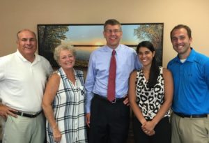 Rachel and Nathaniel Jeffries (right) and John and Laura Crosby (left) at an advocate meeting with Congressman Erik Paulsen of Minnesota (center).