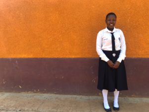 Ejang, 19, at her school in Uganda.