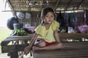 Photo: Chanpisey, 5, photographed at her home in Cambodia. Her father was in a gang and was not responsible with his two children and was violent with his wife while she was pregnant. But after he attended a "Celebrating Families" session run by a local church with the support of World Vision, he changed his behavior. ©World Vision 2017, Oscar Durand.