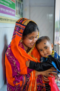 Momtaz Begum, 20, holds her son Junayed Mollah, age one. She came to the Chunkuri Community Clinic for nutrition classes and to have her baby's health status checked.