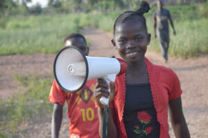 girl in Africa shows ways kids can advocate by spreading health information